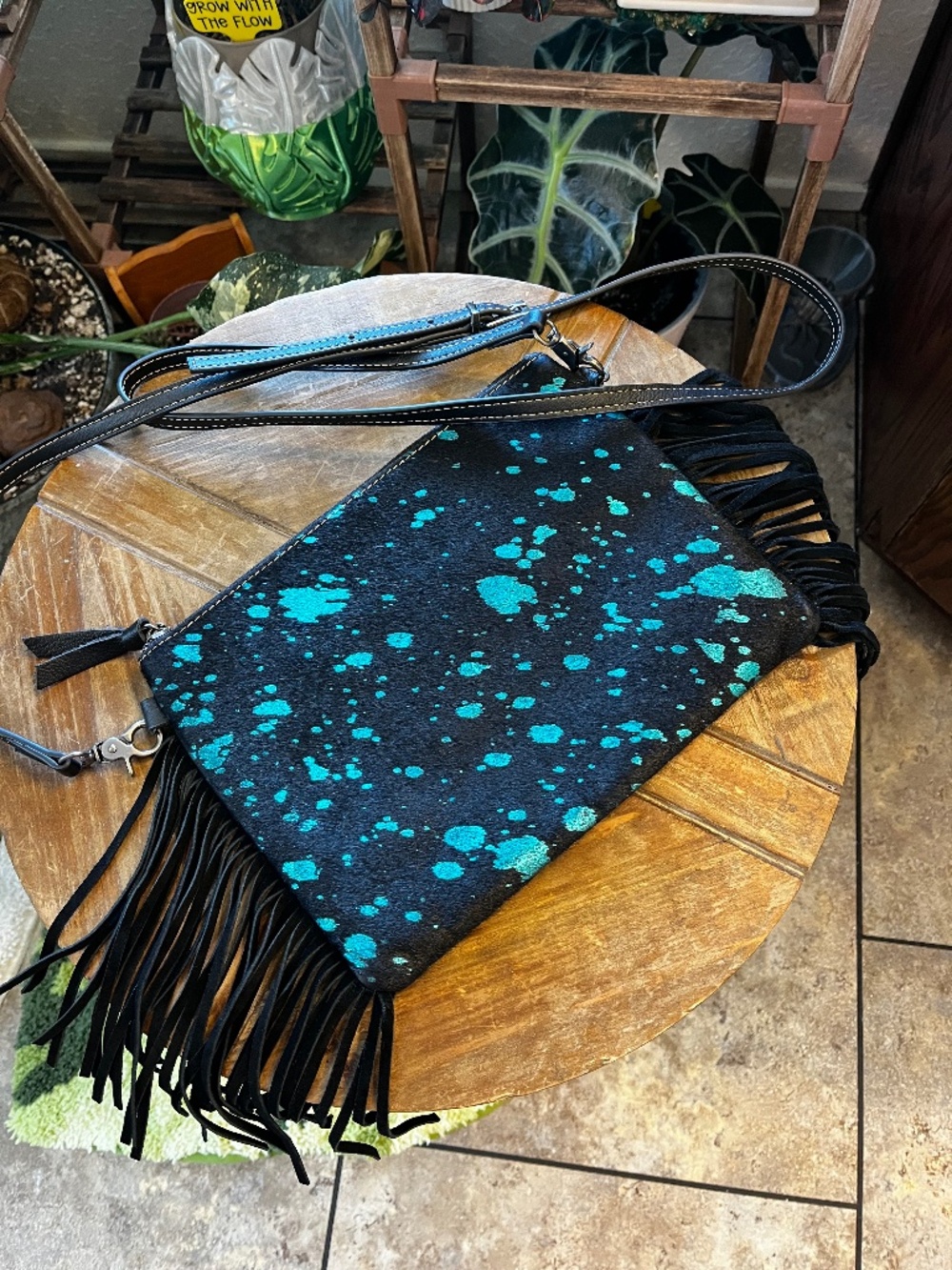 Cowhide leather fringe western handbag.